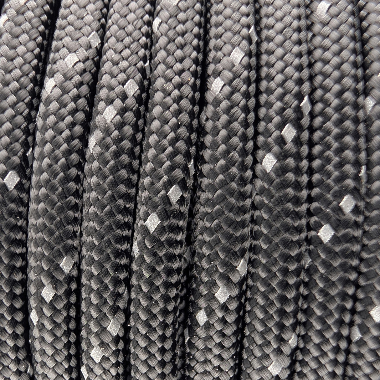Close-up of the woven sheath on Reflective Black Paracord 550, showing 4mm braid