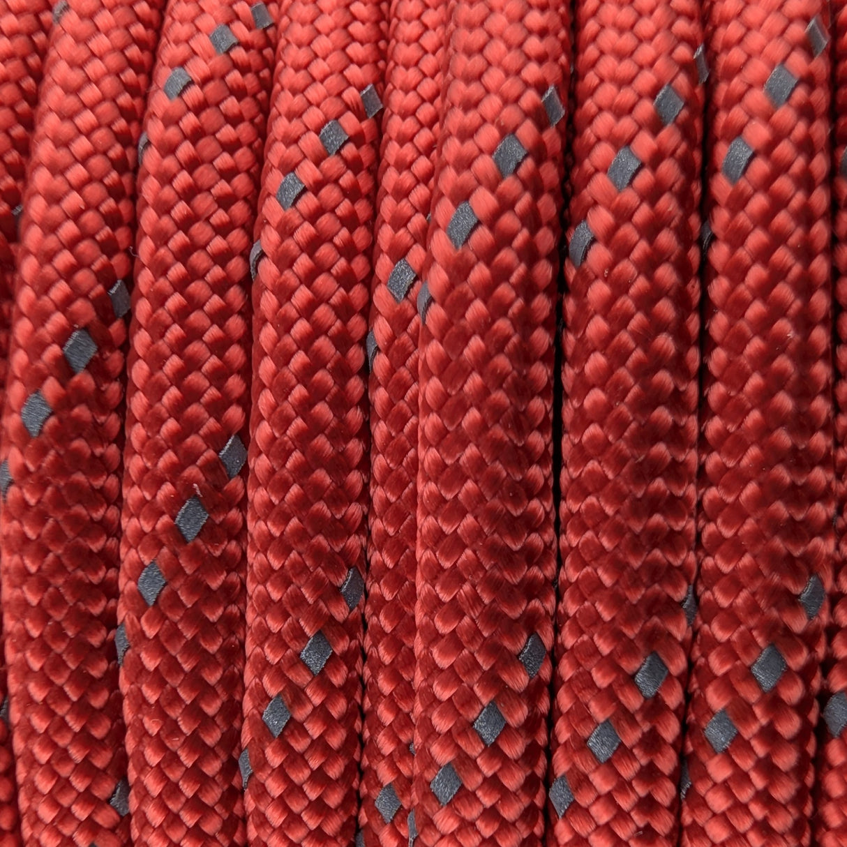 Close-up of the woven sheath on Reflective Red Paracord 550, showing 4mm braid
