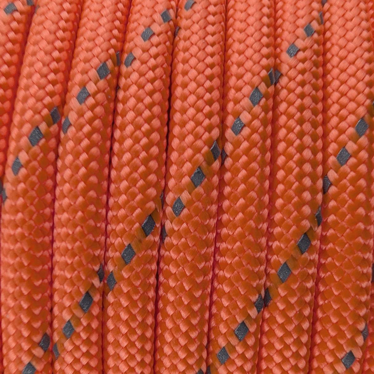 Close-up of the woven sheath on Reflective Fluro Orange Paracord 550, showing 4mm braid